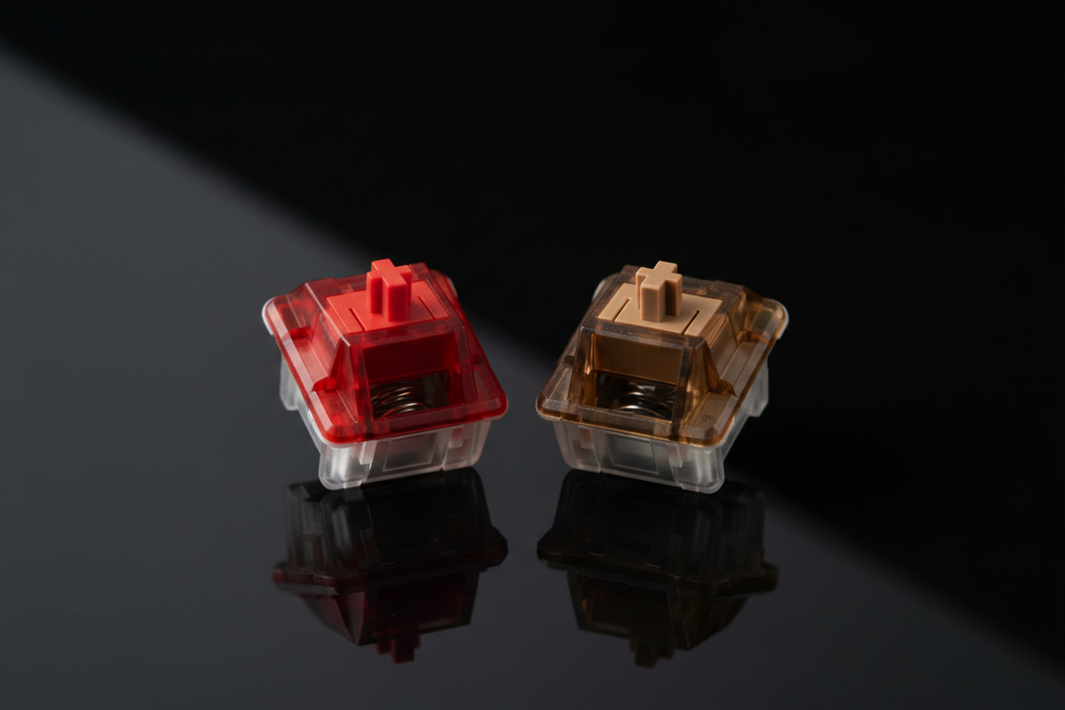 Red and brown mechanical keyboard switches side by side on a black background