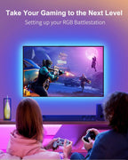Two people gaming on their TV with TV Led backlight strips in a living room