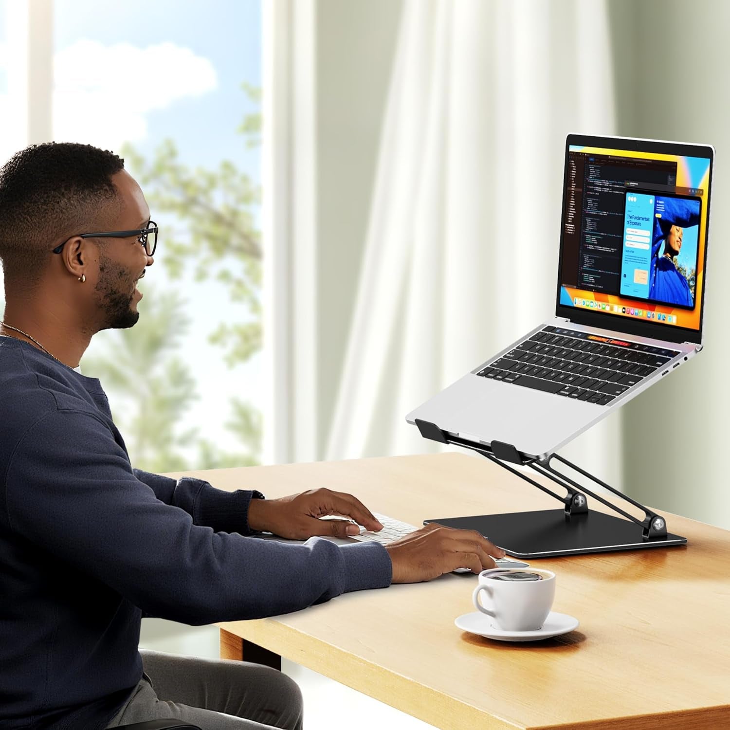 LS10 Aluminum Laptop Stand with man programming using his laptop on the laptop stand