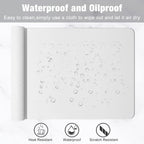 White desk mat with water drops on it, showcasing waterproof and oilproof design on a white background