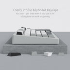 Side profile view of a mechanical keyboard with Cherry profile PBT keycaps showing the sculpted row height differences for ergonomic typing comfort