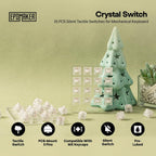 Epomaker Crystal Switch 35-pack silent tactile mechanical keyboard switches displayed with ceramic Christmas tree decoration on sage green background