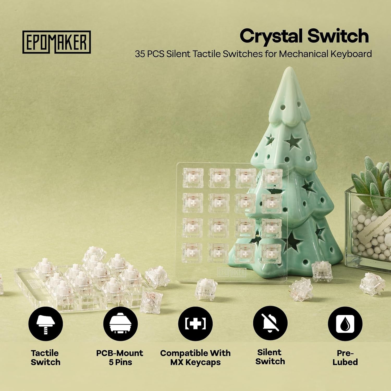 Epomaker Crystal Switch 35-pack silent tactile mechanical keyboard switches displayed with ceramic Christmas tree decoration on sage green background