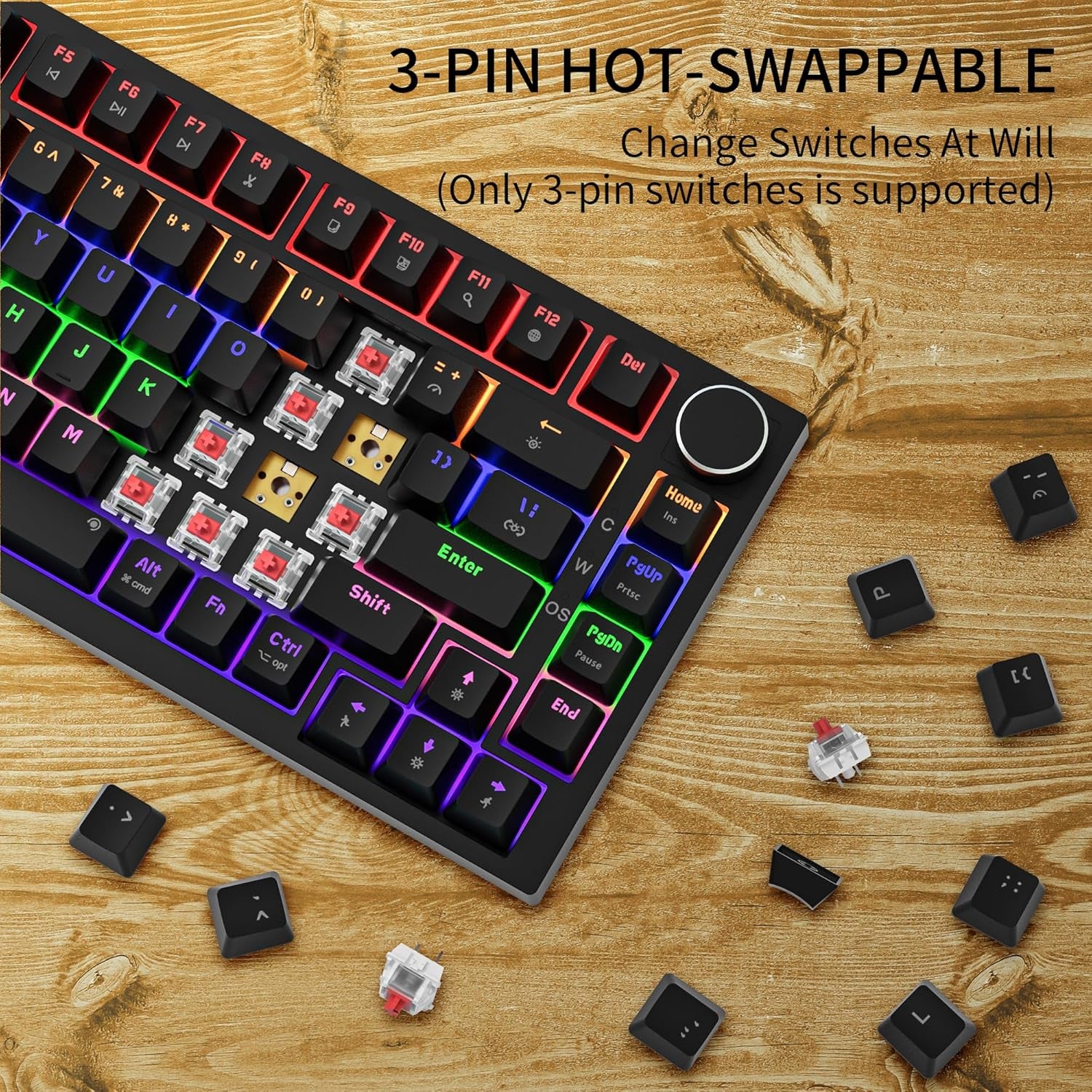 GM326 75% keyboard with keycaps and red linear switches removed to show 3-pin hot-swap PCB, on wood surface