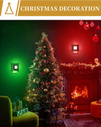 Two DORESshop LED night lights in green and red plugged into wall outlets flanking a decorated Christmas tree with fireplace
