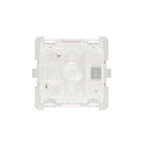 Keyboard switch with red actuator on white background bottom view