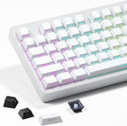 White side-print PBT keycaps installed on a full-size mechanical keyboard with RGB backlighting, black loose keycaps in foreground