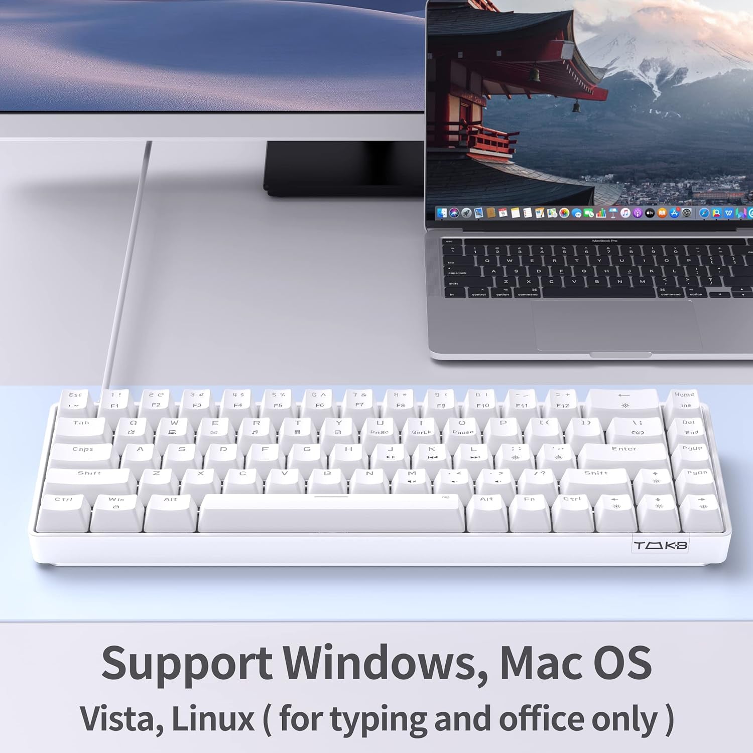 TMKB T68SE white 65% mechanical keyboard on a desk next to a MacBook Pro, with text noting Windows, Mac OS, Vista, and Linux compatibility
