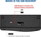 Bottom view of black ergonomic wireless keyboard on a white background with bold blue text reading "Where is the USB Receiver?" at the top, red text reading "USB Receiver is stored in the keyboard battery compartment", a red callout line pointing to the black USB nano receiver shown above the keyboard, and a blue callout line pointing to the battery compartment cover labeled "1AA Battery Required (Not Included)"