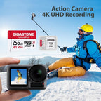 Gigastone 256GB Camera Plus microSD card and SD adapter shown with an action camera and snowboarder filming 4K UHD video