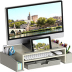 Wooden monitor stand with storage drawer and side caddies in maple finish on white background
