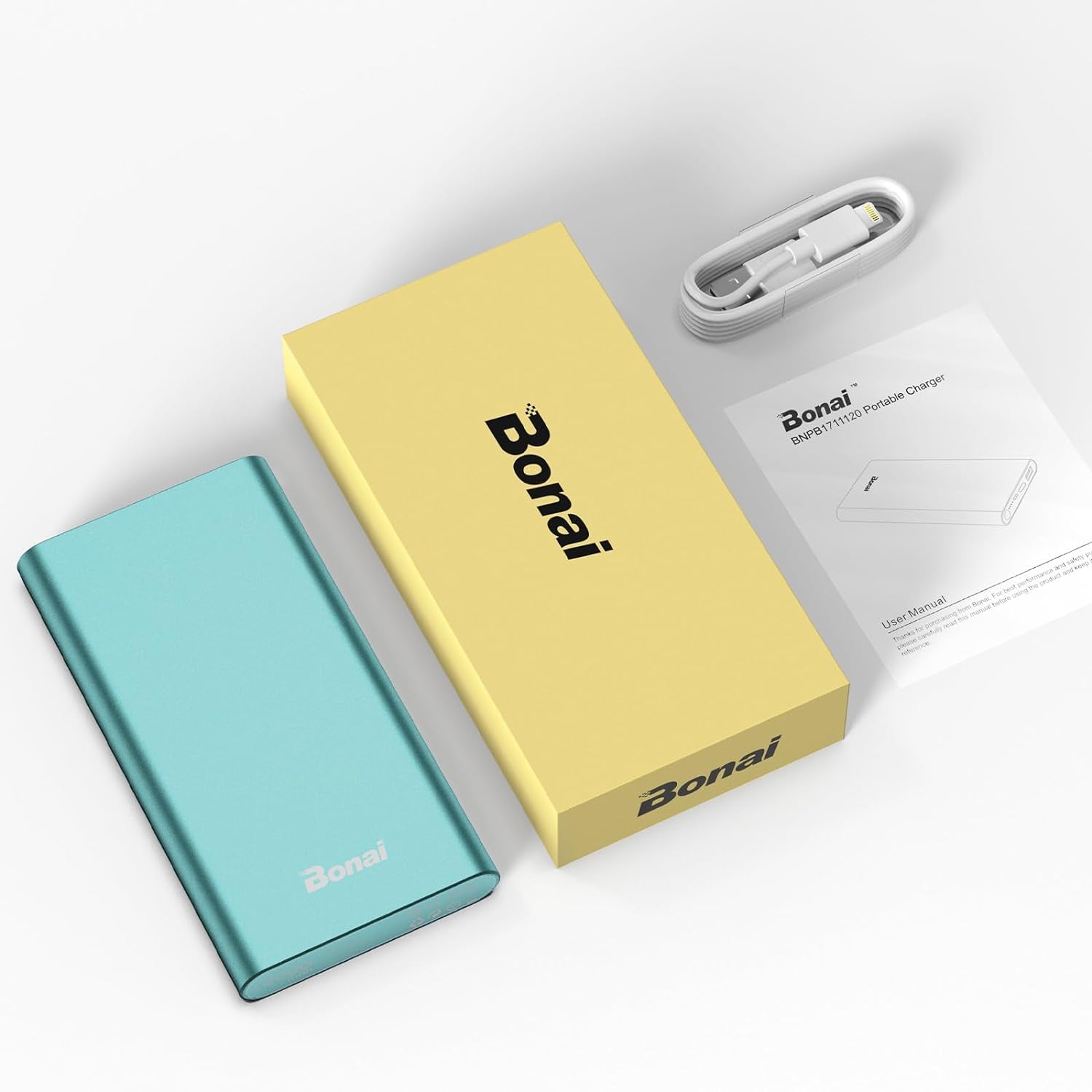 BONAI 12,000 mAh mint portable power bank next to packaging, user manual, and USB-C to USB-A cable on white background