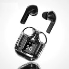 Two black T6 TWS wireless Bluetooth earbuds floating above black transparent charging case showing LED digital battery display reading 90 with L and R earbud battery bar indicators, with soft reflection on white gradient surface