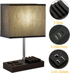 Table lamp with power outlet base on a white background featuring USB ports and AC outlets, with close-up shots of each