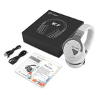White COWIN E7 headphones unboxed on a white background next to the black COWIN E7 retail box, with all included accessories laid out: black USB charging cable, black 3.5mm audio cable, multilingual user guide, and a floral-bordered thank you card