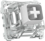 Clear and white mechanical keyboard switch shown from isometric angle, displaying MX-style cross stem and transparent housing