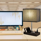 Desk setup with monitor and Briever USB desk lamp with AC outlets and phone stand