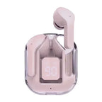 Pink wireless Bluetooth 5.3 earbud in pink transparent charging case front-facing view on white background, one pink earbud ejected upright from case, LED digital battery display reading 90 visible through transparent case front panel, chrome accent trim around case edges