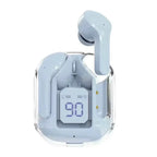 Light blue wireless Bluetooth 5.3 earbud in light blue transparent charging case front-facing view on white background, one light blue earbud ejected upright from case, LED digital battery display reading 90 with L and R earbud battery bar indicators, gold charging pin contacts visible on right inner wall of case